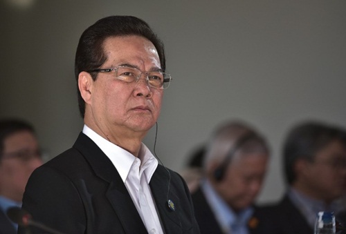 Thủ tướng Nguyễn Tấn Dũng lắng nghe Tổng thống Mỹ Barack Obama phát biểu khai mạc. Ảnh: AFP